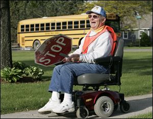 Mr. Mueller began working at Jackman Road Elementary as a school crossing guard about two years after he was diagnosed with multiple sclerosis, a disease that has caused him to lose most of the mobility in his legs.