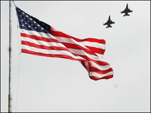 CTY memorial31p         05/30/2009     The Blade/Lori King  The 180th Fighter Wing performs a fly-over during the dedication of the Korean War monument at Clay High School's Memorial Stadium in Oregon, OH.