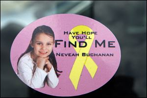 Stickers and flyers with Nevaeh Buchanan's photo are being used in the search for the missing 5-year-old. More than 100 law officers are aiding the investigation.