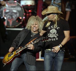 Poison's Bret Michaels, right, and C.C. DeVille performed at the Tonys.