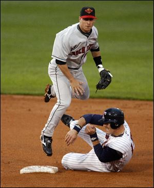 Toledo's Dusty Ryan slides into second base to try and prevent Rochester's Steve Tolleson from turning a double play.