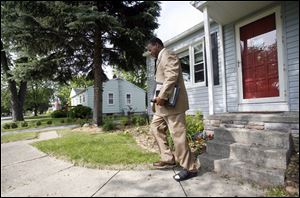 Dennis McConner leaves a Maumee home after no one answered the door.  We take our responsibility very seriously,  he said.