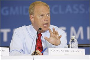 Gov. Ted Strickland participates in a panel discussion, expressing gratitude for federal stimulus funds that he said are helping to deal with the state s budget deficit. He also expressed concern for Ohio auto suppliers having difficulty obtaining credit.  