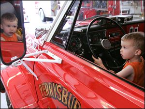 NBRS fire01p  06/27/2009     The Blade/Lori King  Perrysburg Township resident Cooper Bly, 2, plays with a fire truck during open house of the new Perrysburg Township Fire Dept. station in Perrysburg Township, OH.
