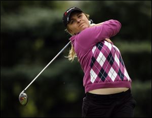 Sarah Kemp fired a 63, the lowest round of the day, to get in a share of the lead.