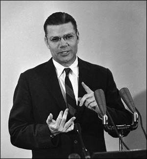 In a Nov. 17, 1961 file photo, Secretary of Defense Robert McNamara holds a news conference at the Pentagon. Former Defense Secretary Robert S. McNamara died Monday, jULY 6, 2009, according to his wife. He was 93.