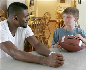 SPT washington07p  07/06/2009     The Blade/Lori King  Tennessee Titan pro football player and Scott High School grad Nate Washington visits cancer patient Jarred Wise, 11, from Whitehouse, OH at the Ronald McDonald House in Toledo, OH. Jarred wanted to meet Nate, so his mom brought him to the house, where Nate gave him a football and told Jarred, 