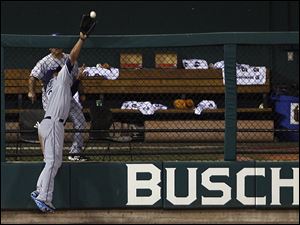 Tampa Bay's Carl Crawford steals a home run from Colorado's Brad Hawpe to help the American League continue its dominance. 