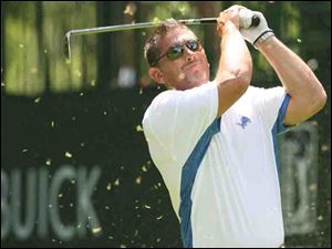 Jim Schwartz tees off at the Buick Open Pro-Am but today he will open training camp as head coach of the Detroit Lions.