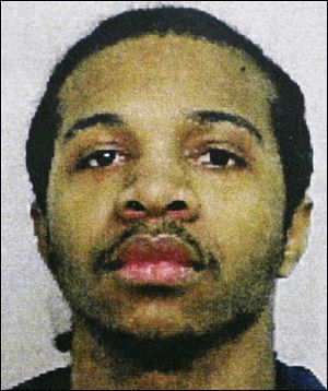 A copy of a photo of Devon Tyrone Woods, provided by Toledo police, Monday, August 11, 2009 is shown.  