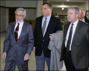 Mark Lair, right, handled security for high-profile trials such as Tom Noe's, center, who is with his lawyer Jon Richardson in 2006.