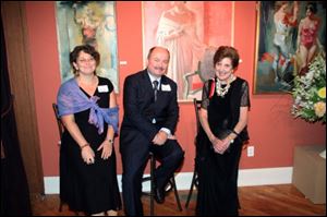 Peggy Grant, right, chats with the Polish Ambassador Adam Kulach and his wife, Olga.