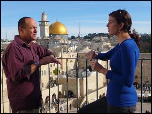In Israel, Kara Cooney, right, and Nimrod Lutz, a Middle Eastern scholar, discuss how acts and images of violence have been a fundamental part of religious beliefs for millennia.