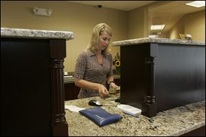 Amy Hayden-Wilson of Haskins is one of Waterford Bank s 29 employees. The bank serves an estimated 600 customers.
