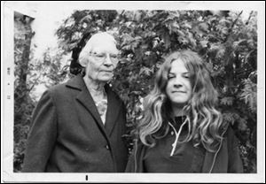 Dorothy Day, co-founder of the Catholic Worker Movement, visits with her young granddaughter, Martha Hennessy, in this undated family photo.