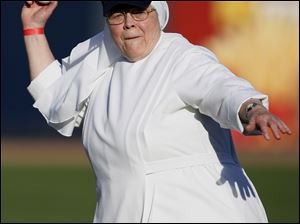 Mother Anne Joseph Doyle of the Little Sisters of the Poor throws out the first pitch before a Mud Hens game at the recent Little Sisters Day, a fund-raiser at Fifth Third Field. Two hundred guests, including some residents, had a cookout at the stadium. The Little Sisters operate the Sacred Heart Home on South Wynn Road in Oregon. Sacred Heart Home offers a continuum of care from independent living apartments to licensed residential and nursing care.