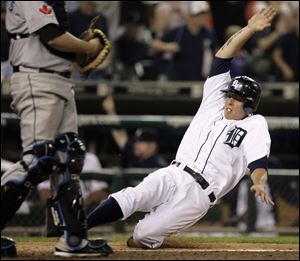 Detroit's Brandon Inge scores the winning run in the the 10thinning against Toronto last night at Comerica Park.  