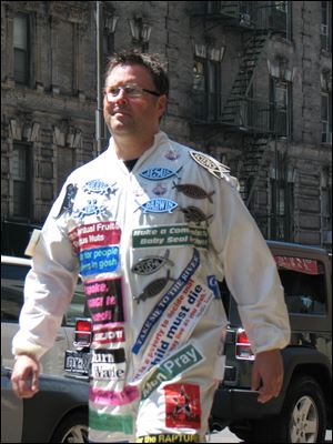 Dan Merchant wore a 'bumper sticker suit' to get people talking in 'Lord Save Us from Your Followers.'