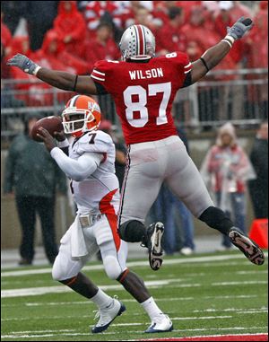 Ohio State defensive lineman Lawrence Wilson puts pressure on
Illinois quarterback Juice Williams. Wilson had an interception in the second half to set up a field goal in the Buckeyes' victory.