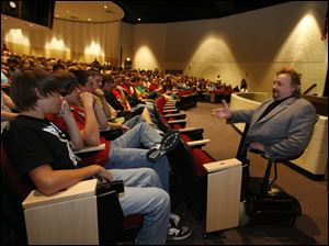NBRN speaker30p      Ronnie (cq) Bachman, right, speaking to Monroe High School students.  Ronnie (cq) Bachman, of Plymouth, Michigan, speaks to Monroe High School students in Monroe, Michigan on September 21, 2009. Bachman, who lost his legs at age four, encouraged students to not belittle or abuse others who are different from the norm or from themselves.  The Blade/Jetta Fraser