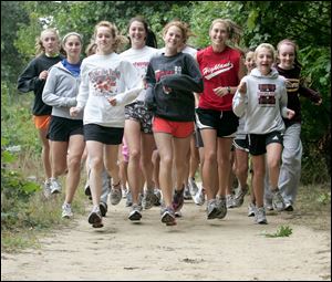 Front, from left, Meredith Wagner, Moe Dean and Abby Masters lead the Northview girls team through a workout.