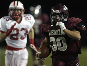 Genoa's Greg Hillabrand pulls away from Eastwood's Jake Rogers on a 75-yard touchdown run. Hillabrand had 181 yards rushing.
<BR>
<img src=http://www.toledoblade.com/graphics/icons/photo.gif> <font color=red><b>VIEW</b></font>: <a href=