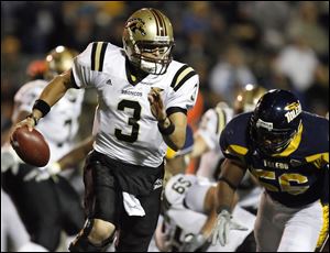 Western Michigan quarterback Tim Hiller throws downfield during the second quarter. He moved into a tie for third place in Mid-American Conference history with 87 career touchdown passes.