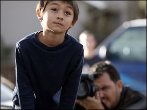 Falcon Heene sits in the back of his parents' pickup after he was found hiding in a box in the family's garage in Fort Collins, Colo. 