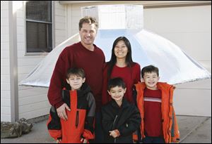In this TV publicity image release by ABC, the Heene family, clockwise from bacl left, Richard, Mayumi, Ryan, Falcon and Bradford are shown at their home in Fort Collins, Colo. on Nov 15, 2008. The Heene family was featured on the 100th episode of the ABC reality series, Wife Swap,