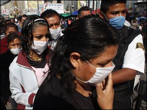 Mexico City residents quickly took to wearing protective masks when the flu appeared in April and it appeared the flu was killing as many as one victim in 15.