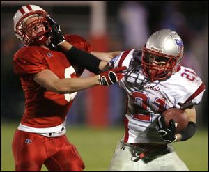 Patrick Henry running back Justin Buenger, right, stiff-arms Eastwood's Branden Abke.
<br>
<img src=http://www.toledoblade.com/graphics/icons/photo.gif> <font color=red><b>VIEW</b></font>: <a href=