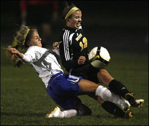 Anthony Wayne's Anna Coffman, left, and Northview's Chelsea Nye battle for the ball yesterday in girls Division I district soccer semifinal. The Wildcats defeated the Generals 2-1 in OT. 