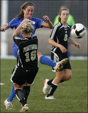 St. Ursula's Katie David gets her foot into the ball as Perrysburg's Kelsey Draper (16) attempts to fend off David's kick in yesterday's district semifinal in Sylvania. Anthony Wayne's Anna Coffman, left, and Northview's Chelsea Nye battle for the ball yesterday in girls Division I district soccer semifinal. The Wildcats defeated the Generals 2-1 in OT.