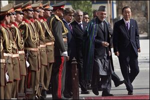 Afghan President Hamid Karzai, second right, inspects with U.N. Secretary-General Ban Ki-moon, right, an honor guard in Kabul, Afghanistan, Monday, Nov. 2, 2009. The U.N. chief made a surprise visit to Afghanistan as Afghanistan's election commission has canceled Saturday's presidential runoff and proclaimed Karzai victor of the war-ravaged nation's tumultuous ballot.