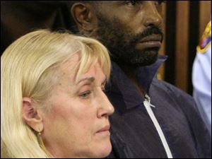Anthony Sowell, with public defender Kathleen DeMetz, makes his initial court appearance in the murder cases.