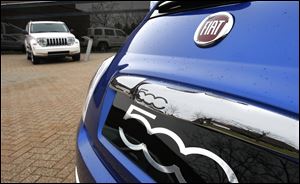 A Jeep Patriot and a Fiat 500 were among vehicles displayed for yesterday's announcements. The firm hinted that a new Fiat could be made in Toledo.