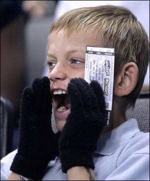 Michael Deutsch, a fifth grader at Lagrange Elementary, gets vocal during yesterday's game with Kalamazoo, in which the Walleye rallied to post a 5-4 win in overtime. Students from a number of school districts in the region were on hand for the game in the new arena, which opened last month.