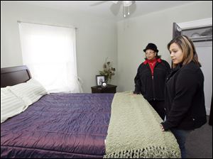 Slug:CTY tour08p                         Date 11/7/2009           The Blade/ Amy E. Voigt                   Location: Toledo, Ohio  CAPTION:  Lisa Crawford, left, and Nicole Reno, right, look at the master bedroom at 2313 Portsmouth during the Tour Toledo Preview of Homes tour that was open to the public on November 7, 2009.