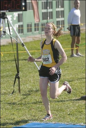 Northview senior Meredith Wagner crosses the finish line at Scioto Downs to win the state title in Division I. She pulled away from the pack in the second mile, eventually winning by almost four seconds. Last year, she placed 12th at the state meet.
