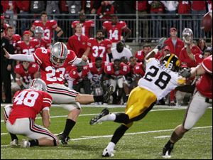 Ohio State Devin Barclay connects for his game-winning 39-yard field goal in overtime to beat Iowa at Ohio Stadium. The Buckeyes' Daniel Herron scoots into the end zone for an 11-yard touchdown run in the fourth quarter. Herron finished with 97 yards rushing as Ohio State piled up more than 200 yards on the ground. Ohio State is 9-2 overall and 6-1 in the Big Ten.