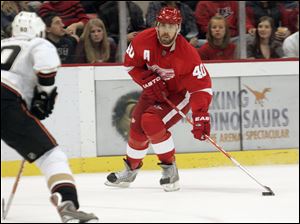 The Red Wings' Henrik Zetterberg looks for a teammate during the first period. His goal with 4:31 left in the third put Detroit up for good, and he later added an empty-netter for the hat trick.