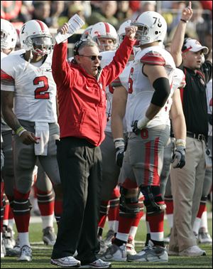 Jim Tressel reacts after an Ohio State interception Saturday. He's looking forward to his coaching debut in the Rose Bowl.