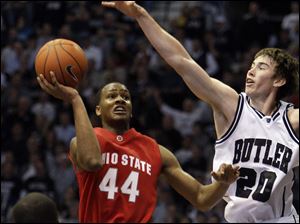 Ohio State's William Buford takes a shot against Butler's Gordon Hayward. Hayward scored 24 points and had eight rebounds.