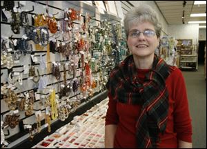 Julia Robertson in her shop. Meant to Bead
<br>
<img src=http://www.toledoblade.com/assets/jpg/TO66067417.JPG> <b><font color=red>VIEW: </b></font color=red> <a href=