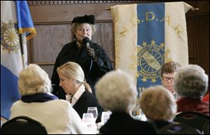 Patsy Johnson Gaines as Susan B. Anthony punctuates her address at the DAR assemblage at the Toledo Club with details of her arrest for voting.