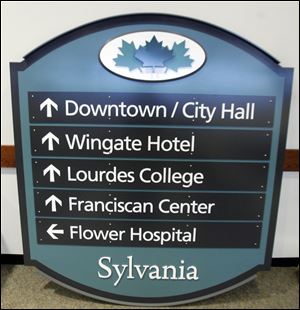 A sample wayfinding sign is on display in Sylvania City Council Chambers.