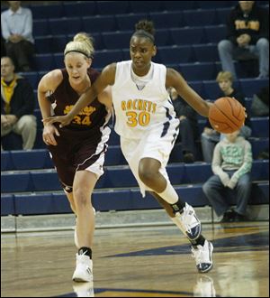 Toledo's Tanika Mays fends off Central Michigan's Kaihla Szunko on the way to the hoop yesterday. Mays has been recovering from the flu, but she still finished with 22 points and 13 rebounds.
