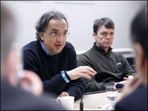 Sergio Marchionne, left, with the CEO of the Jeep brand, Mike Manley, said the first half of the year will be difficult. The second half is when the new Jeep Grand Cherokee becomes available.
