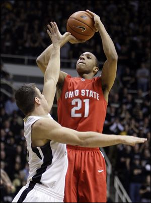 Ohio State's Evan Turner shoots over Purdue's Chris Kramer in the first half.