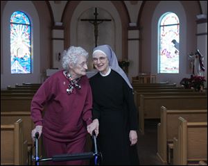 Sister Cecilia Mary Sartorius, new mother superior of the Little Sisters of the Poor in Oregon, is getting to know the residents of the Sacred Heart Home for the Aged, including Florence Wawrzyniak, 99.
